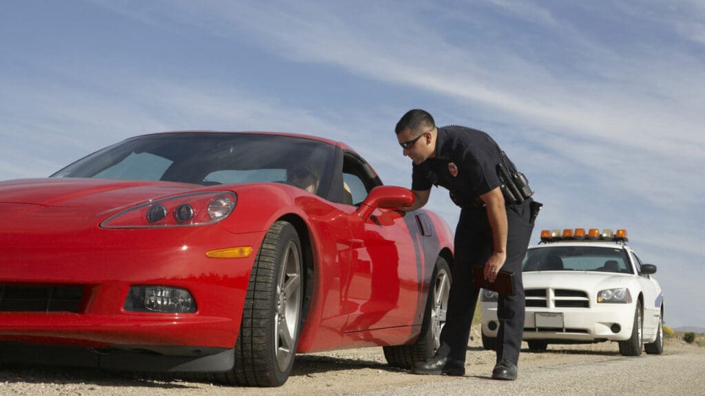 police-stop of red sports car in desert